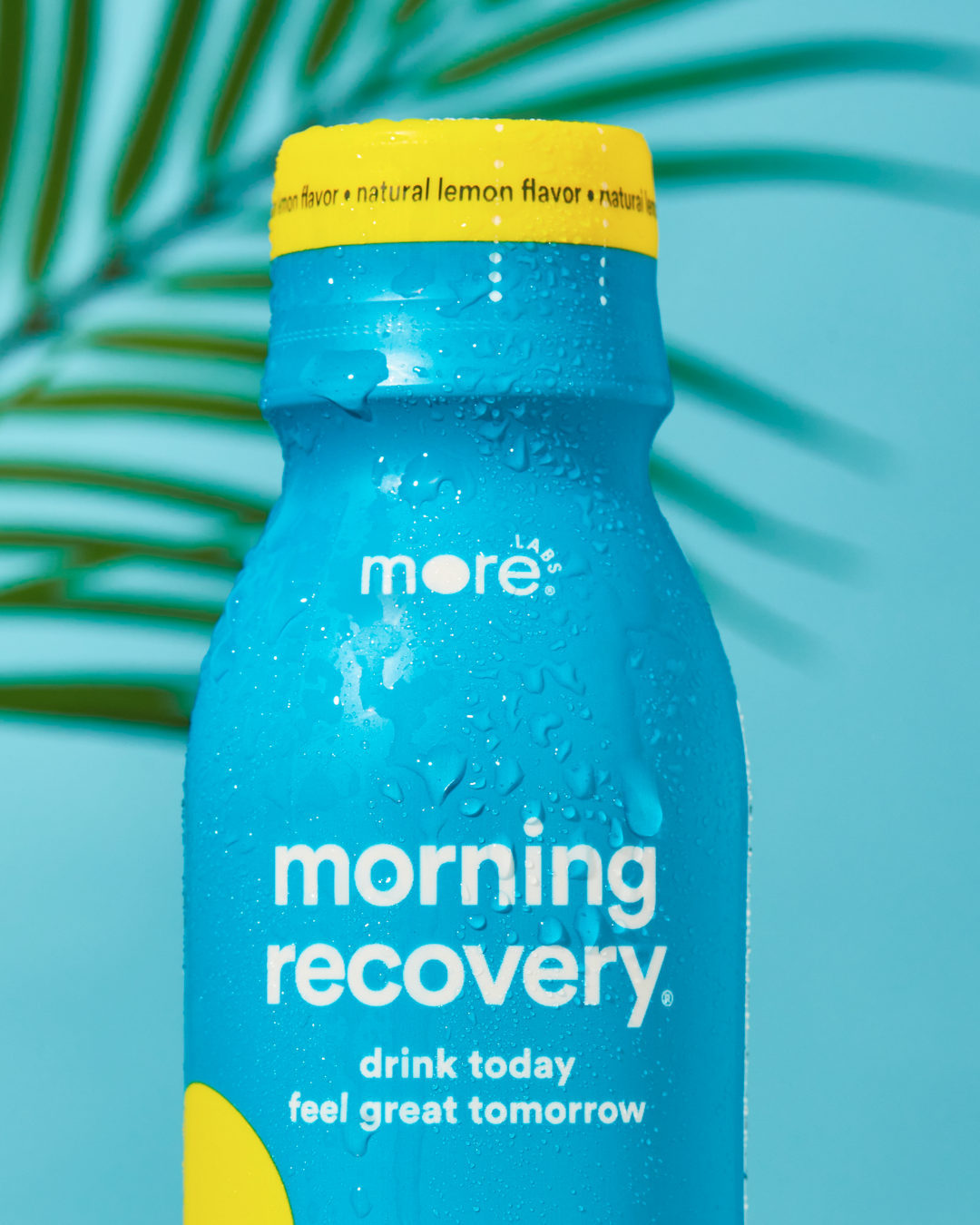 A chilled bottle of Morning Recovery by More Labs with water droplets, symbolizing hydration and freshness.
