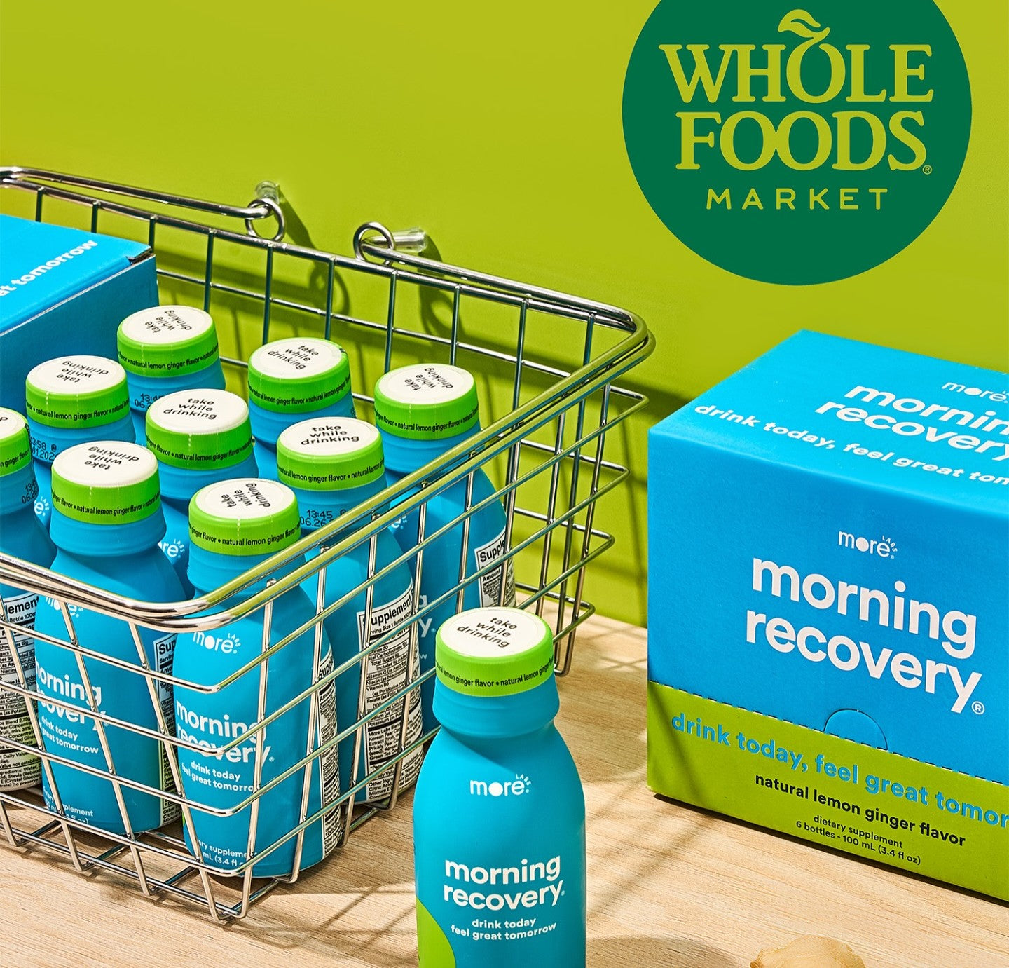  A display of bottles of More Labs’ Morning Recovery supplement, surrounded by lemon slices and ginger. 